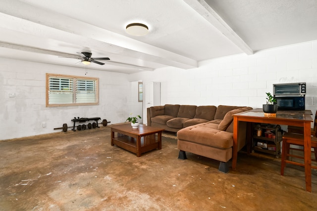 8562-B Elepaio Rd, Kekaha, HI 96752 - living area featuring unfinished concrete flooring, concrete block wall, a ceiling fan, plenty of natural light, and beam ceiling