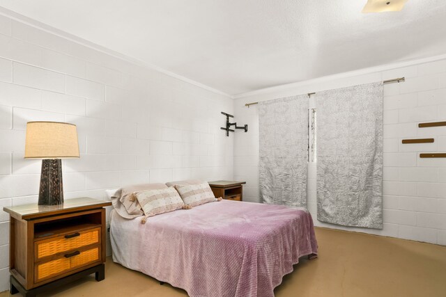 8562-B Elepaio Rd, Kekaha, HI 96752 - bedroom with crown molding and finished concrete flooring