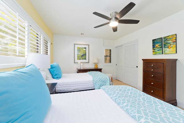 68-3840 Lua Kula St Unit H100, Waikoloa, HI 96738 - bedroom featuring a closet, baseboards, and ceiling fan