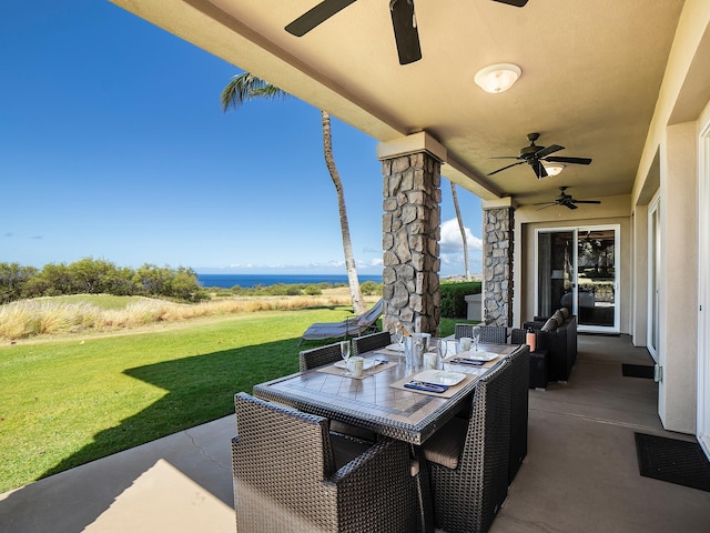 62-3614 Lolii Way Unit E-2, Kamuela, HI 96743 - view of patio / terrace featuring a ceiling fan, outdoor dining space, and a water view