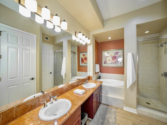 62-3614 Lolii Way Unit E-2, Kamuela, HI 96743 - bathroom featuring double vanity, a shower stall, a bath, and wood finished floors