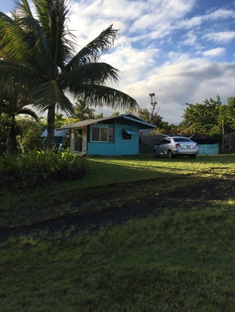 12-132 Kipuka, Pahoa, HI 96778 - view of home's exterior featuring a lawn