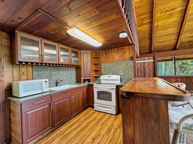 94-2664 Lorenzo Rd, Naalehu, HI 96772 - kitchen with white appliances, wood ceiling, a sink, light wood-style floors, and wooden walls