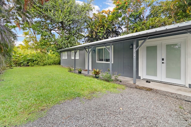 14-3479 Nanawale Blvd, Pahoa, HI 96778 - view of property exterior featuring a lawn