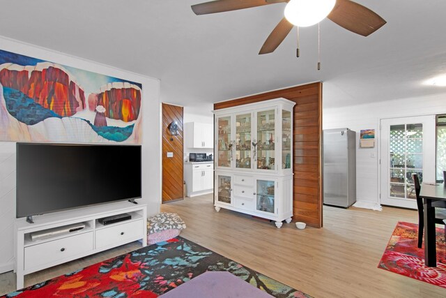 14-3479 Nanawale Blvd, Pahoa, HI 96778 - living area with wood finished floors, wooden walls, and a ceiling fan