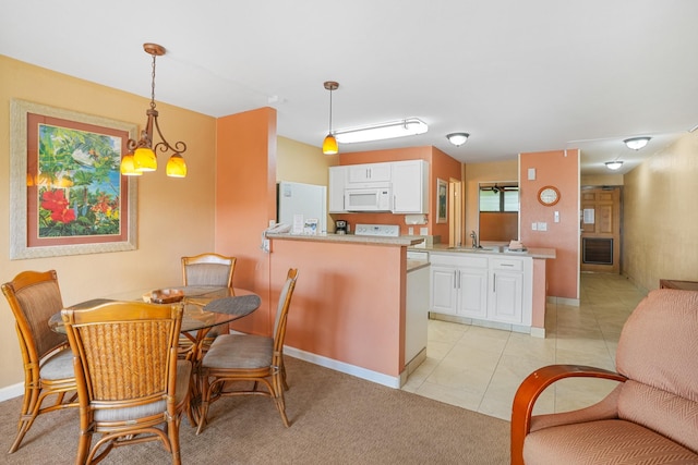 5017 Lawai Rd Unit C202, Koloa, HI 96756 - dining space featuring light tile patterned floors, baseboards, and a chandelier