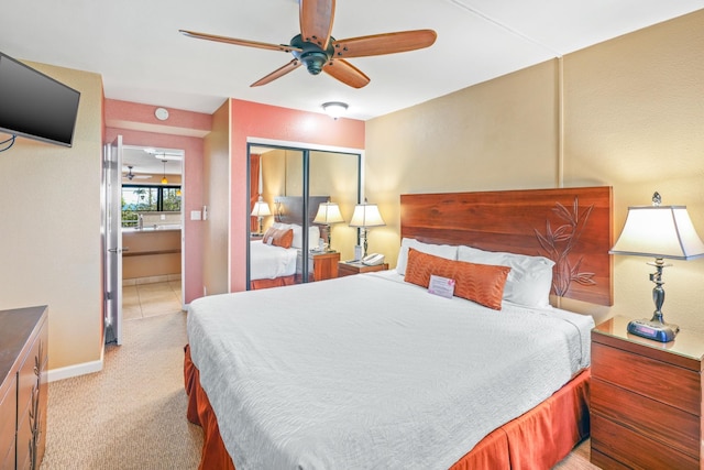 5017 Lawai Rd Unit C202, Koloa, HI 96756 - bedroom featuring baseboards, light carpet, a ceiling fan, and a closet