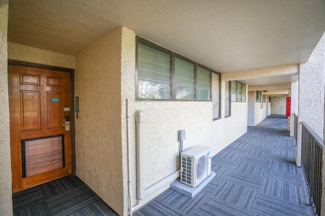 5017 Lawai Rd Unit C202, Koloa, HI 96756 - view of exterior entry with ac unit and stucco siding