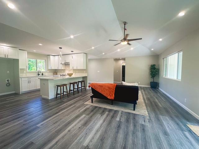15-1878 31st Ave, Keaau, HI 96749 - living area featuring baseboards, a ceiling fan, dark wood-style floors, recessed lighting, and vaulted ceiling