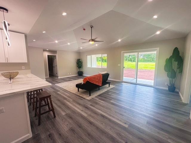 15-1878 31st Ave, Keaau, HI 96749 - living room featuring baseboards, dark wood-style floors, vaulted ceiling, a ceiling fan, and recessed lighting