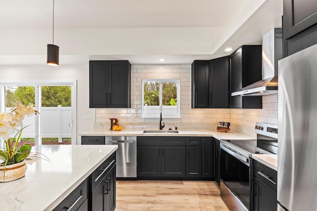 16-2072 Bamboo Dr, Pahoa, HI 96778 - kitchen featuring stainless steel appliances, wall chimney range hood, dark cabinets, a sink, and recessed lighting