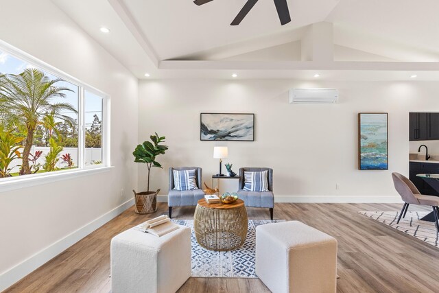16-2072 Bamboo Dr, Pahoa, HI 96778 - sitting room with an AC wall unit, a ceiling fan, light wood-style floors, recessed lighting, and baseboards