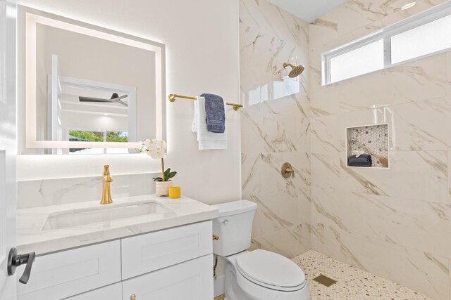 16-2072 Bamboo Dr, Pahoa, HI 96778 - bathroom with a tile shower, toilet, vanity, and healthy amount of natural light