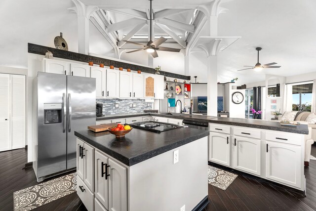 73-1238 Kaiminani Dr, Kailua-Kona, HI 96740 - kitchen featuring stainless steel fridge, a ceiling fan, a peninsula, dark countertops, and high vaulted ceiling