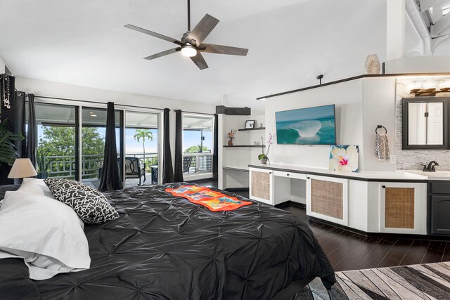 73-1238 Kaiminani Dr, Kailua-Kona, HI 96740 - bedroom with access to exterior, multiple windows, dark wood-style floors, lofted ceiling, and a sink