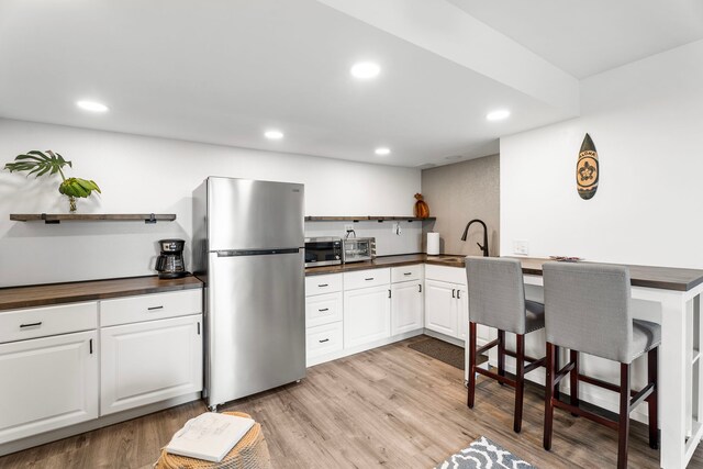 73-1238 Kaiminani Dr, Kailua-Kona, HI 96740 - kitchen with appliances with stainless steel finishes, open shelves, a sink, light wood-type flooring, and recessed lighting