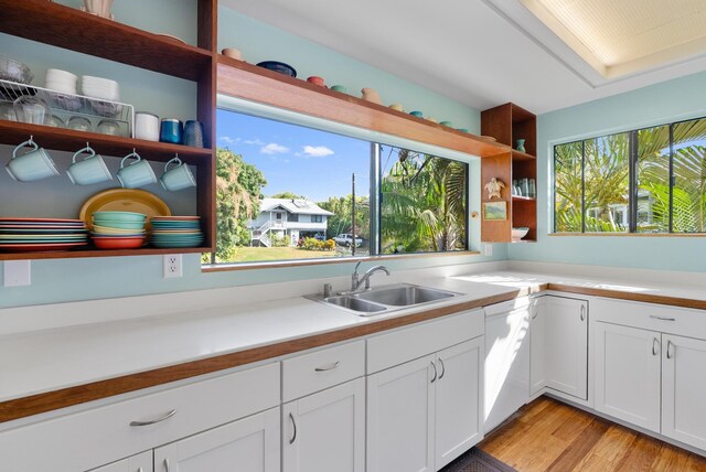 77-112 Nahale Pl, Kailua-Kona, HI 96740 - kitchen featuring a sink, open shelves, white dishwasher, light wood finished floors, and light countertops