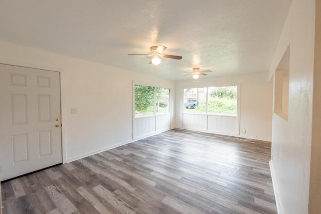15-2746 Lai St, Pahoa, HI 96778 - unfurnished room featuring ceiling fan, wood finished floors, a textured ceiling, and baseboards