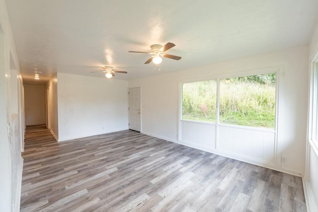 15-2746 Lai St, Pahoa, HI 96778 - empty room with light wood-type flooring, a ceiling fan, and baseboards