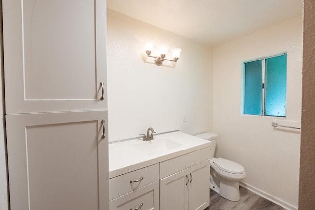 15-2746 Lai St, Pahoa, HI 96778 - bathroom with toilet, wood finished floors, and vanity