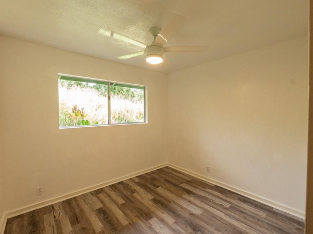 15-2746 Lai St, Pahoa, HI 96778 - unfurnished room featuring dark wood finished floors, baseboards, and a ceiling fan