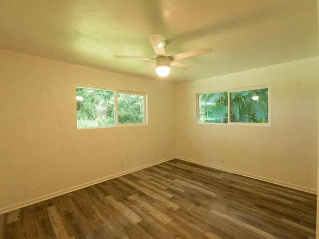 15-2746 Lai St, Pahoa, HI 96778 - spare room with dark wood-style flooring, a ceiling fan, and baseboards