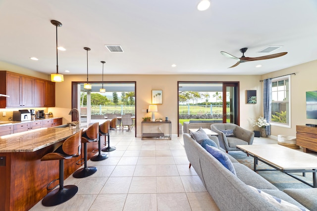 78-120 Holuakai St, Kailua-Kona, HI 96740 - living room featuring healthy amount of natural light, a ceiling fan, light tile patterned floors, baseboards, and recessed lighting