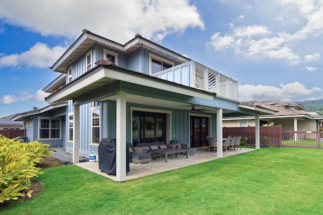 78-120 Holuakai St, Kailua-Kona, HI 96740 - rear view of property featuring board and batten siding, a patio area, ceiling fan, and outdoor lounge area