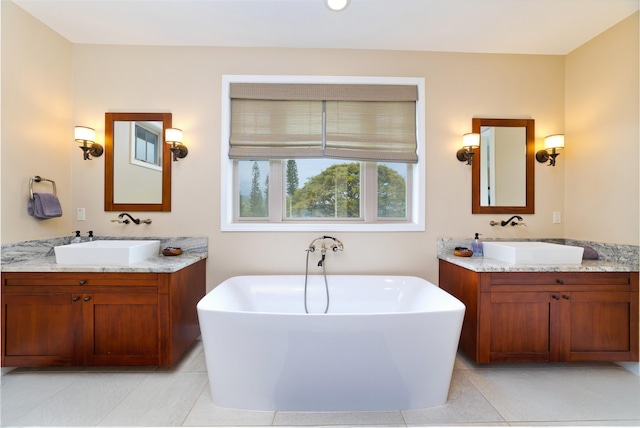 78-120 Holuakai St, Kailua-Kona, HI 96740 - full bath with a freestanding bath, two vanities, and tile patterned flooring