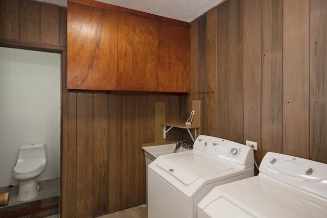 27-296 Kaieie Rd, Papaikou, HI 96781 - washroom featuring washing machine and clothes dryer and wooden walls