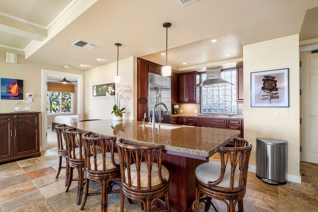 62-3600 Amaui Pl Unit F102, Kamuela, HI 96743 - kitchen featuring a sink, wall chimney exhaust hood, appliances with stainless steel finishes, a breakfast bar, and recessed lighting