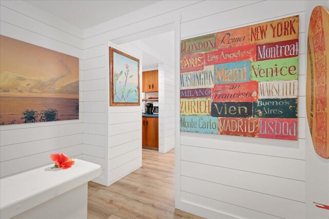 78-261 Manukai St Unit 3403, Kailua-Kona, HI 96740 - hallway with light wood-style floors and wood walls