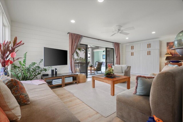 78-261 Manukai St Unit 3403, Kailua-Kona, HI 96740 - living room featuring recessed lighting, light wood-type flooring, a ceiling fan, and wooden walls