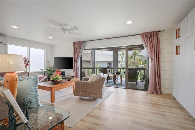 78-261 Manukai St Unit 3403, Kailua-Kona, HI 96740 - living room with light wood finished floors, a ceiling fan, recessed lighting, and wooden walls