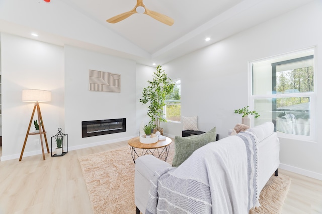 16-2050 Coconut Dr, Pahoa, HI 96778 - living area featuring wood finished floors, a ceiling fan, lofted ceiling, a glass covered fireplace, and recessed lighting