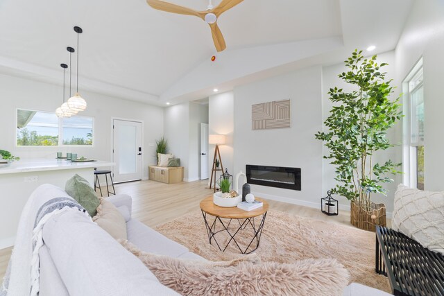 16-2050 Coconut Dr, Pahoa, HI 96778 - living room with recessed lighting, light wood-style flooring, a ceiling fan, a glass covered fireplace, and vaulted ceiling