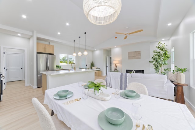 16-2050 Coconut Dr, Pahoa, HI 96778 - dining room featuring light wood-style floors, recessed lighting, a fireplace, a ceiling fan, and lofted ceiling