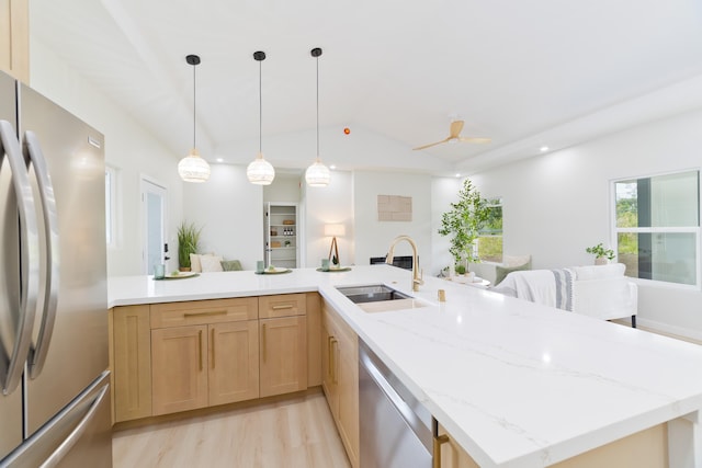 16-2050 Coconut Dr, Pahoa, HI 96778 - kitchen featuring stainless steel appliances, light wood-style flooring, light stone counters, light brown cabinetry, and lofted ceiling