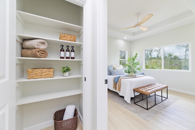 16-2050 Coconut Dr, Pahoa, HI 96778 - bedroom featuring wood finished floors, a raised ceiling, and ceiling fan