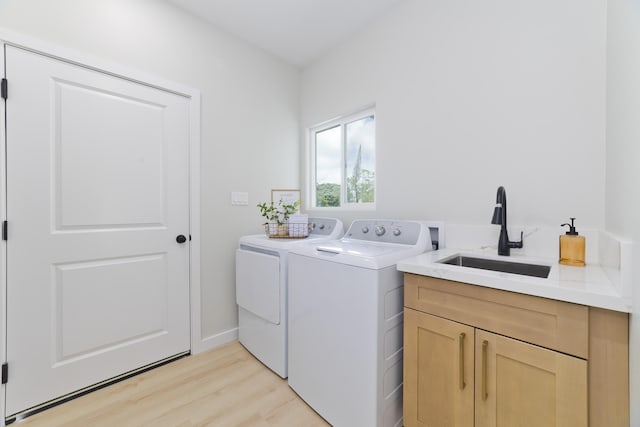 16-2050 Coconut Dr, Pahoa, HI 96778 - laundry room with cabinet space, washer and clothes dryer, and light wood finished floors