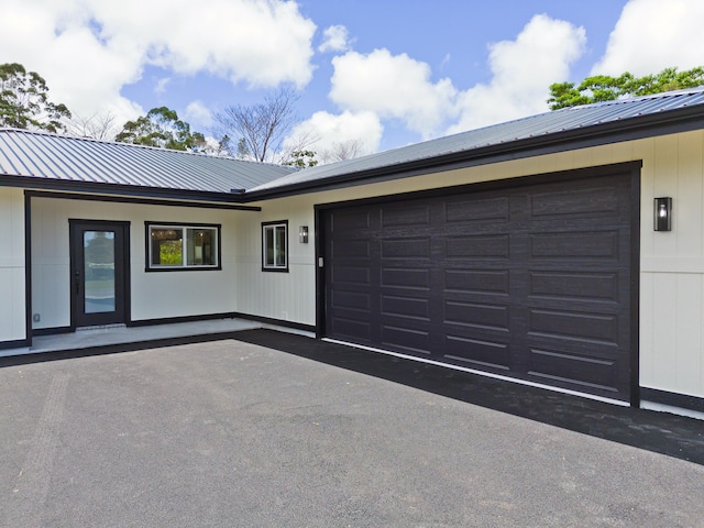 16-2050 Coconut Dr, Pahoa, HI 96778 - view of front of house featuring a metal roof, a garage, and driveway