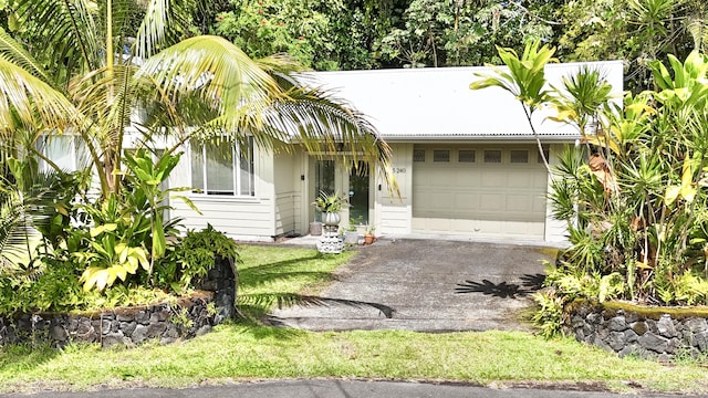 15-240 N Puni Makai Loop, Pahoa, HI 96778 - view of front of property with an attached garage and asphalt driveway