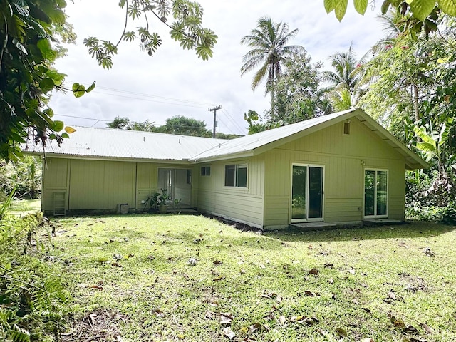 15-240 N Puni Makai Loop, Pahoa, HI 96778 - rear view of house with a lawn