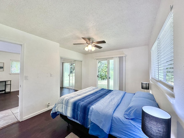 15-240 N Puni Makai Loop, Pahoa, HI 96778 - bedroom featuring access to outside, multiple windows, a textured ceiling, a ceiling fan, and wood finished floors
