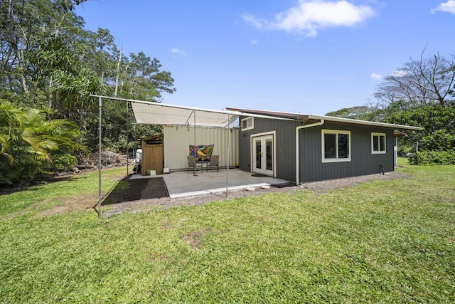 15-2035 12th Ave, Keaau, HI 96749 - rear view of house with french doors, a patio, and a yard