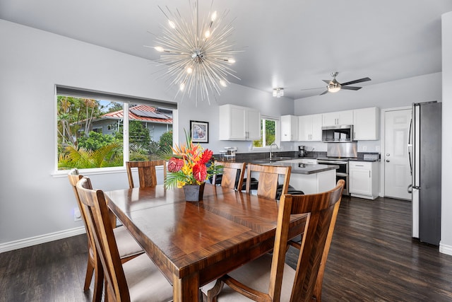 73-4100 Kulanui Pl, Kailua-Kona, HI 96740 - dining area featuring a chandelier, dark wood-type flooring, baseboards, and ceiling fan