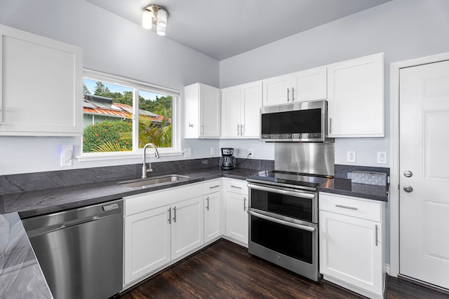 73-4100 Kulanui Pl, Kailua-Kona, HI 96740 - kitchen featuring appliances with stainless steel finishes, a sink, dark wood-type flooring, and white cabinetry