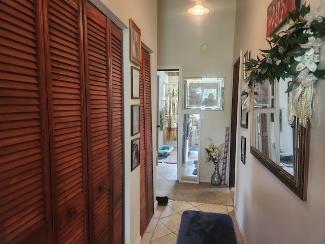 16-2126 Sugarcane Ln, Pahoa, HI 96778 - corridor featuring light tile patterned floors, light colored carpet, and baseboards