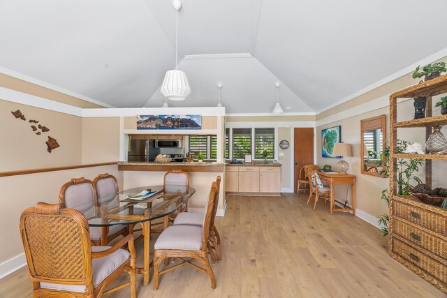 2253 Poipu Rd Unit 207, Koloa, HI 96756 - dining area featuring lofted ceiling, light wood-style floors, baseboards, and crown molding