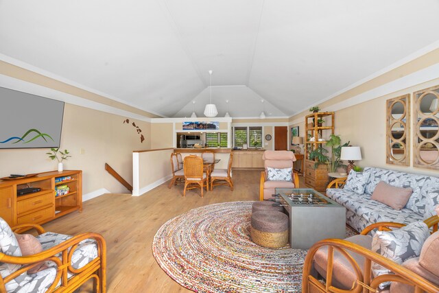 2253 Poipu Rd Unit 207, Koloa, HI 96756 - living room featuring vaulted ceiling, light wood finished floors, and baseboards